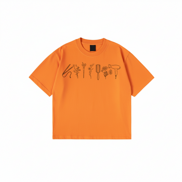 Hairstylist T-Shirt with floral salon tool print on black cotton fabric
