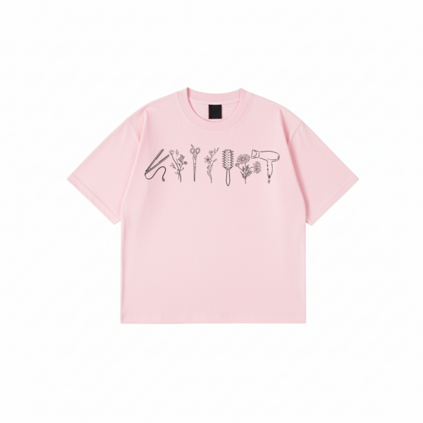 Hairstylist T-Shirt with floral salon tool print on black cotton fabric